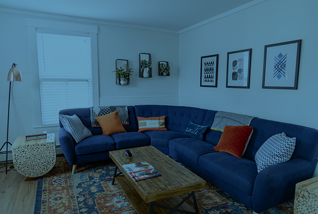Welcoming living room with a navy blue couch