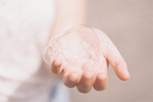 Hand Extending with a soap bubble.