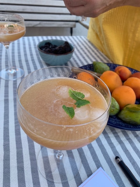 A bellini on a striped table cloth in Venice, Italy. 