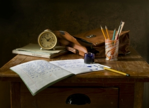 Academic writing retreat London; brown wooden desk with notebook and pen; Photo by Pixabay