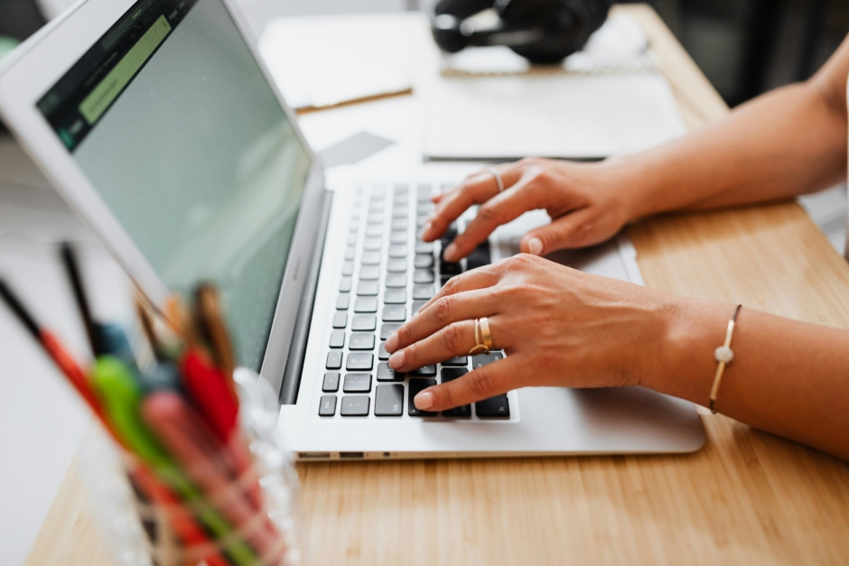 Person typing on a laptop computer